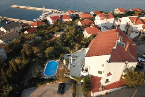 Seaside apartments with a swimming pool Kali, Ugljan - 14116
